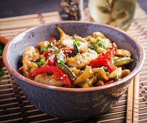 Stir fry chicken, zucchini, sweet peppers and green onion. Asian cuisine